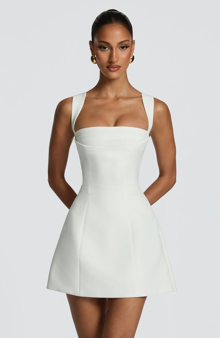 Women's fitted mini dress with wide straps and elegant neckline StylebySassy