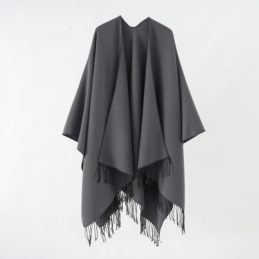 Women's fashionable fringe poncho made of soft material with luxurious drape StylebySassy