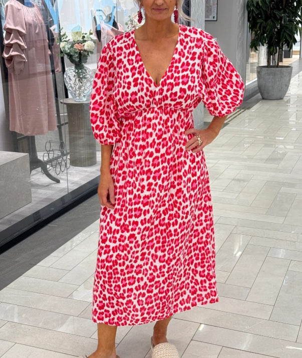 Women's maxi dress with deep V-neck, voluminous puff sleeves, and smocked waist seam StylebySassy