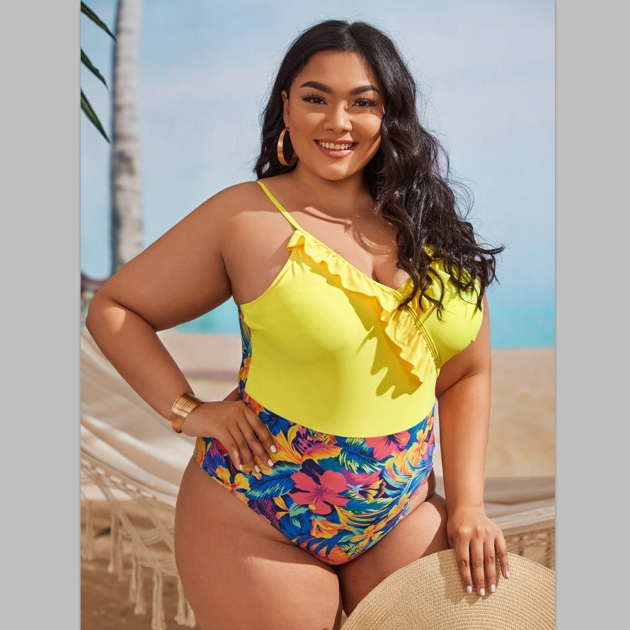 Women's one-piece swimsuit with asymmetrical ruffle design and floral pant area StylebySassy