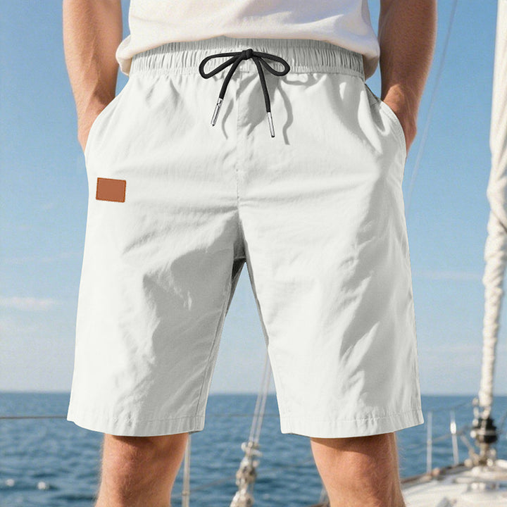 Men's quick-drying swim shorts in Bermuda cut with elastic waistband and drawstring StylebySassy
