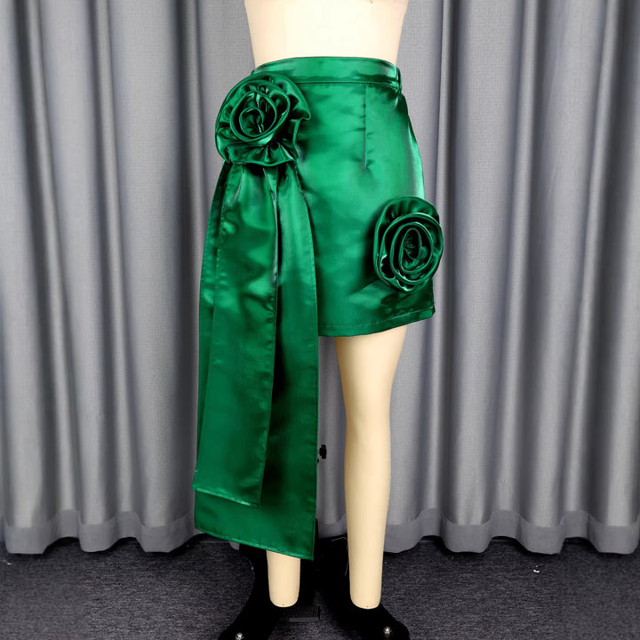 Women’s satin skirt with floral ruffle design and fitted bow detail.