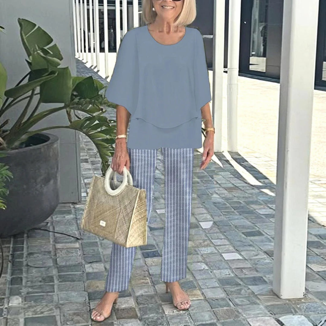 Women's layered tunic with cape sleeves and ankle-length straight leg pants with graphic print StylebySassy