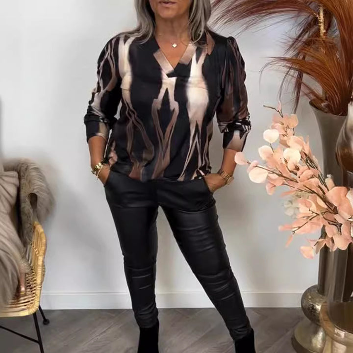Women stylish casual set made of V-neck print shirt and leather look leggings StylebySassy