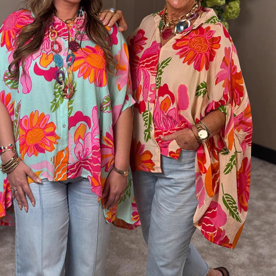 Women's airy oversized resort-style shirt blouse with large floral print and asymmetrical scalloped hem StylebySassy
