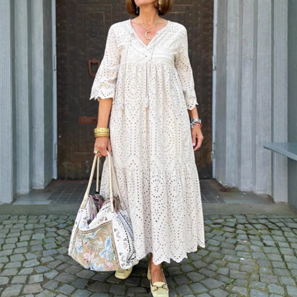 Women's flowing maxi dress with openwork embroidery, V-neck, underbust seam, and ruffled skirt StylebySassy