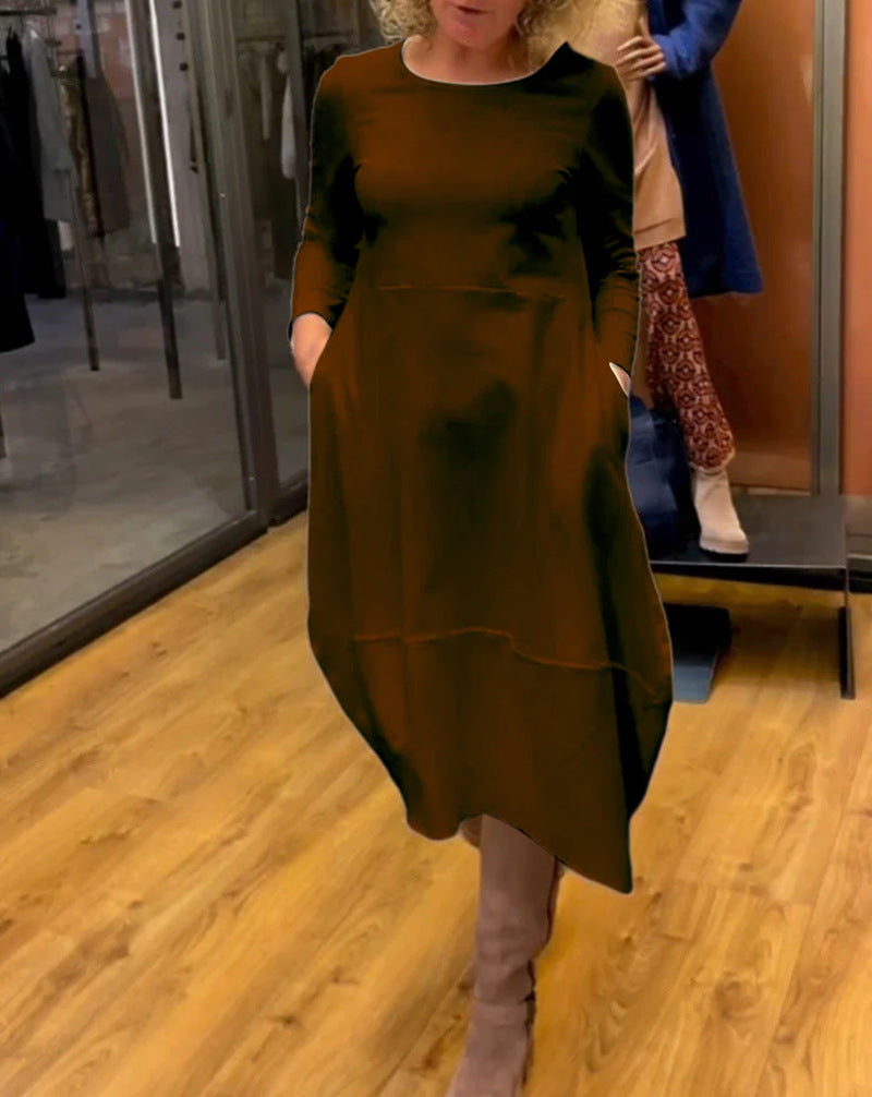 Women's asymmetrical balloon dress with three-quarter sleeves, side pockets, and flowing pointed hem StylebySassy