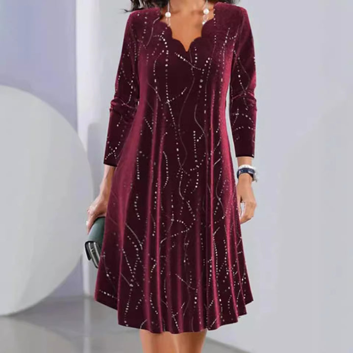 Women's nano velvet A-line dress with curved neckline, long sleeves, and rhinestone embellishment StylebySassy