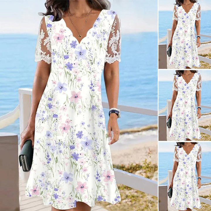Ladies flowing midi beach dress with wavy V-neck and sheer lace sleeves StylebySassy