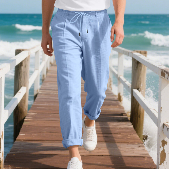 Men's beach-suitable linen blend lounge pants with elastic drawstring, subtle pleat, and rolled ankle hem StylebySassy