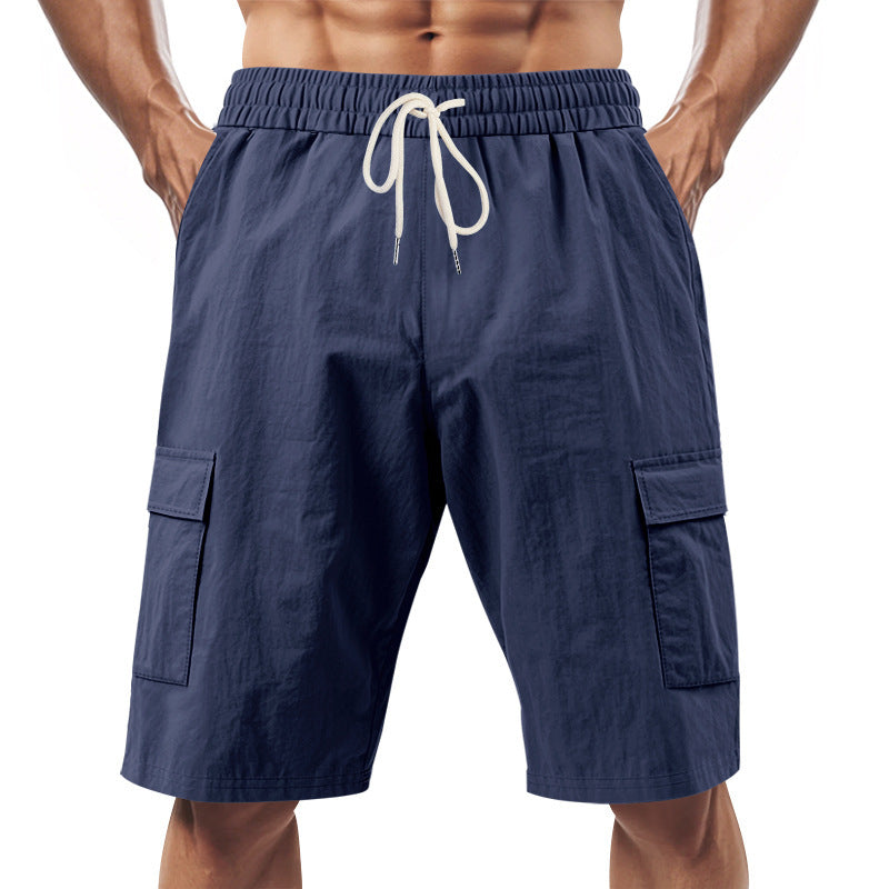 Men's technical cargo shorts with elastic drawstring waistband, secure flap pockets, and quick-drying functional material StylebySassy