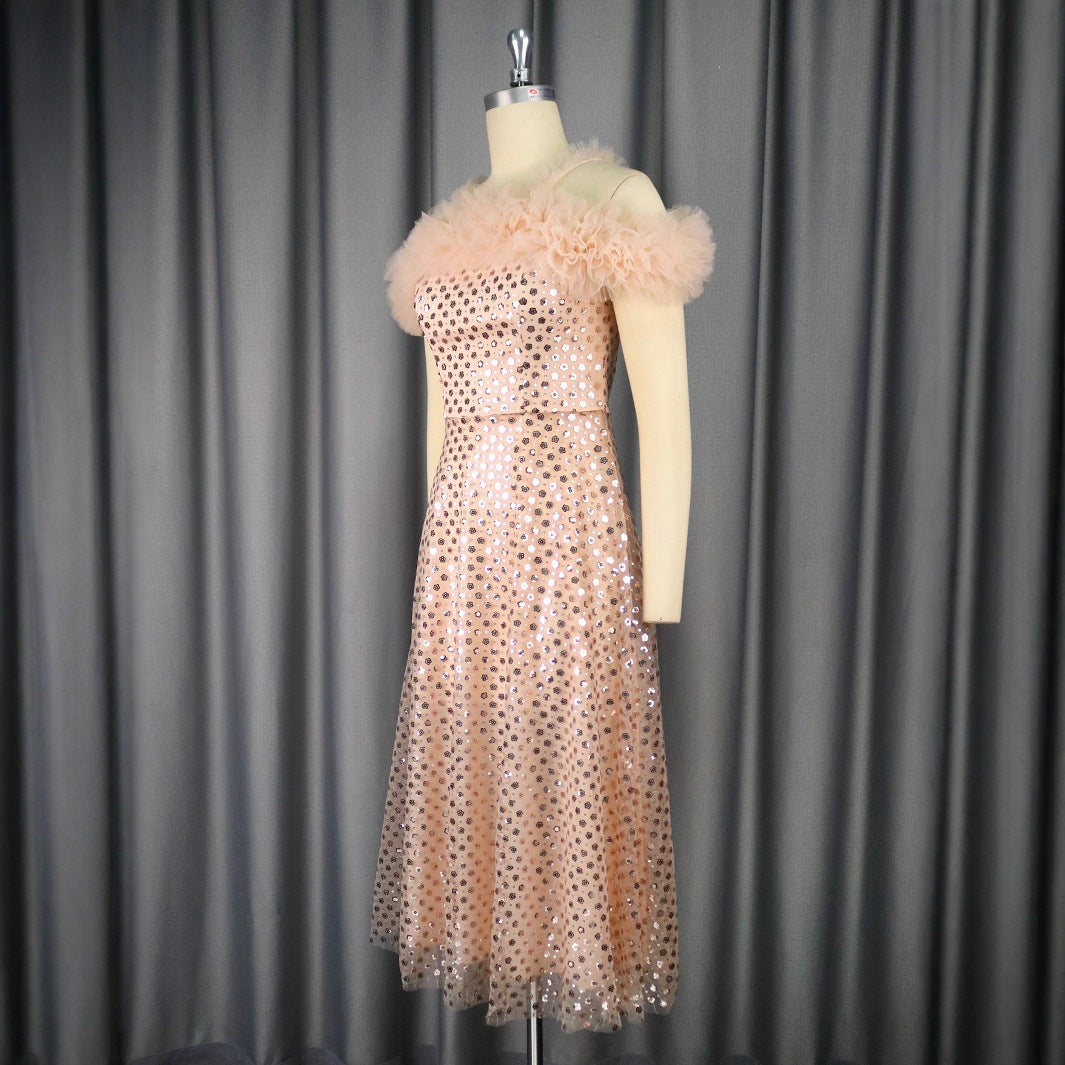 Women’s festive evening dress with voluminous ruffle details and delicate glitter StylebySassy