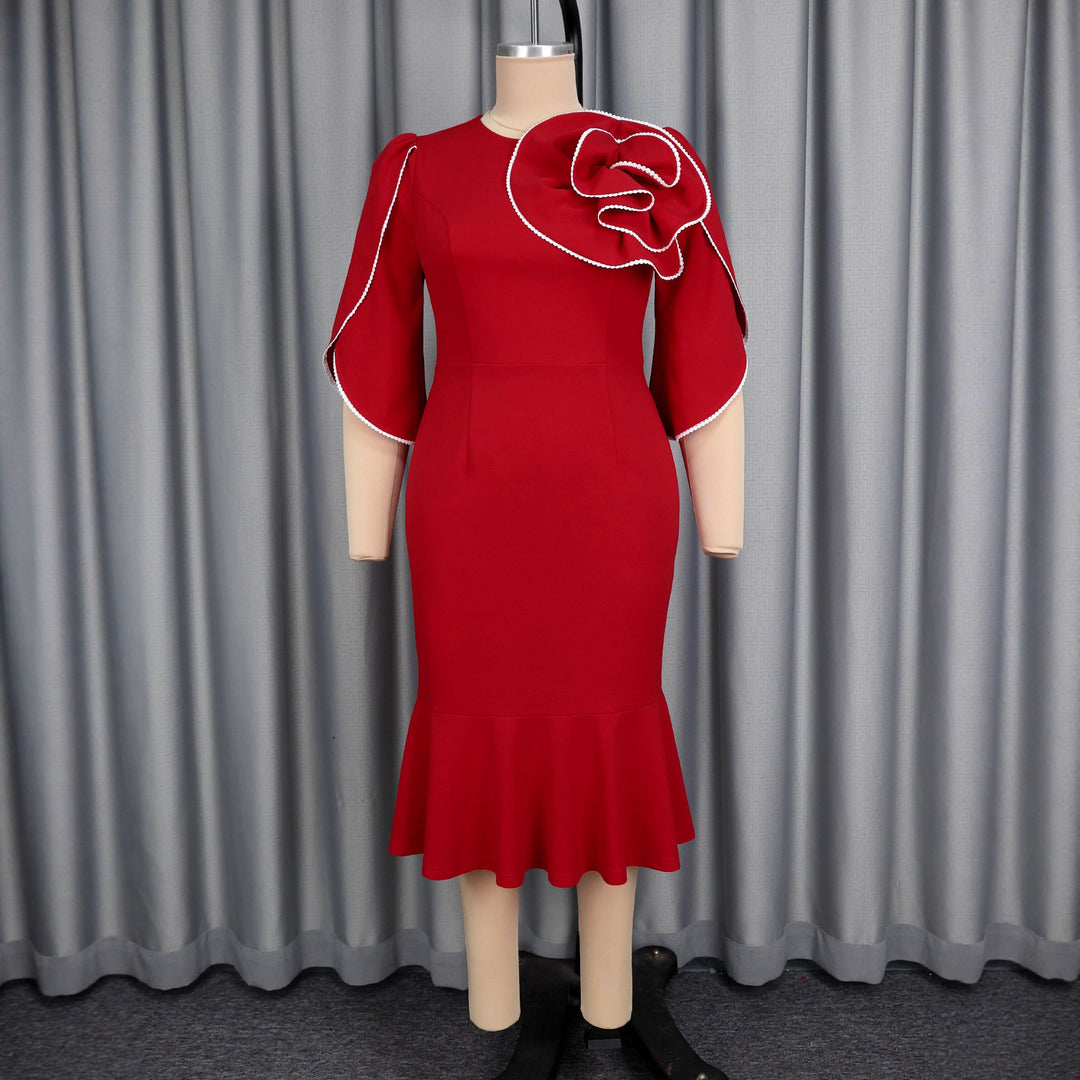 Ladies fitted evening dress with peplum and voluminous ruffle design StylebySassy