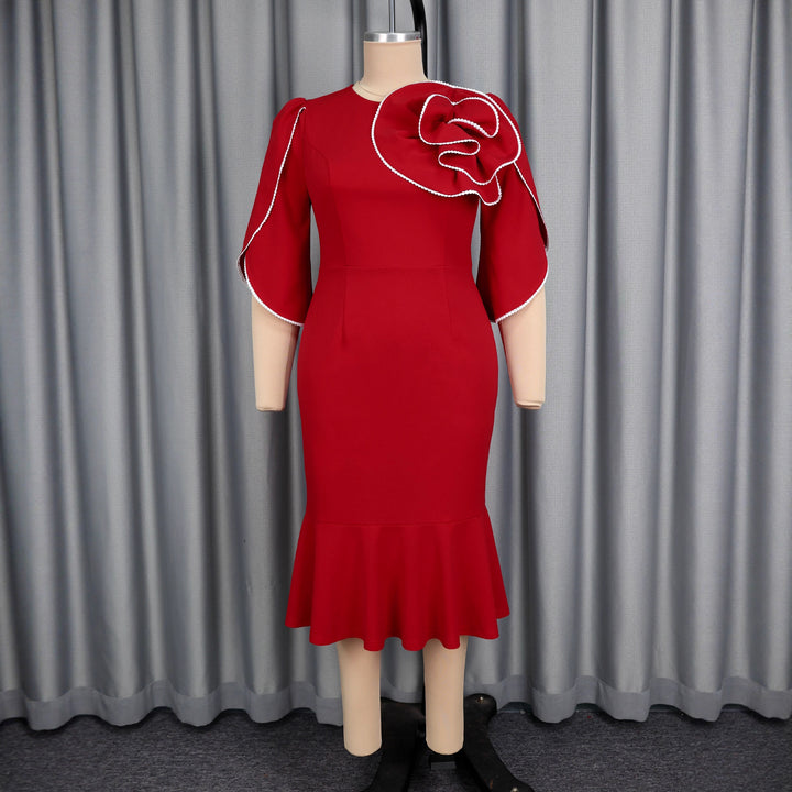 Ladies fitted evening dress with peplum and voluminous ruffle design StylebySassy