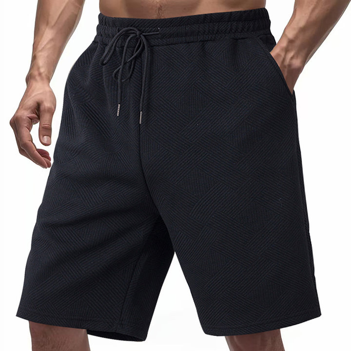 Men's knee-length textured swim shorts with elastic drawstring waistband and side pockets StylebySassy