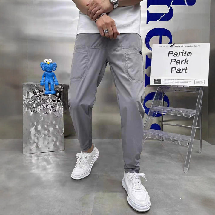 Men's sporty cargo jogger pants with elastic waistband, drawstring, and tapered leg hem StylebySassy