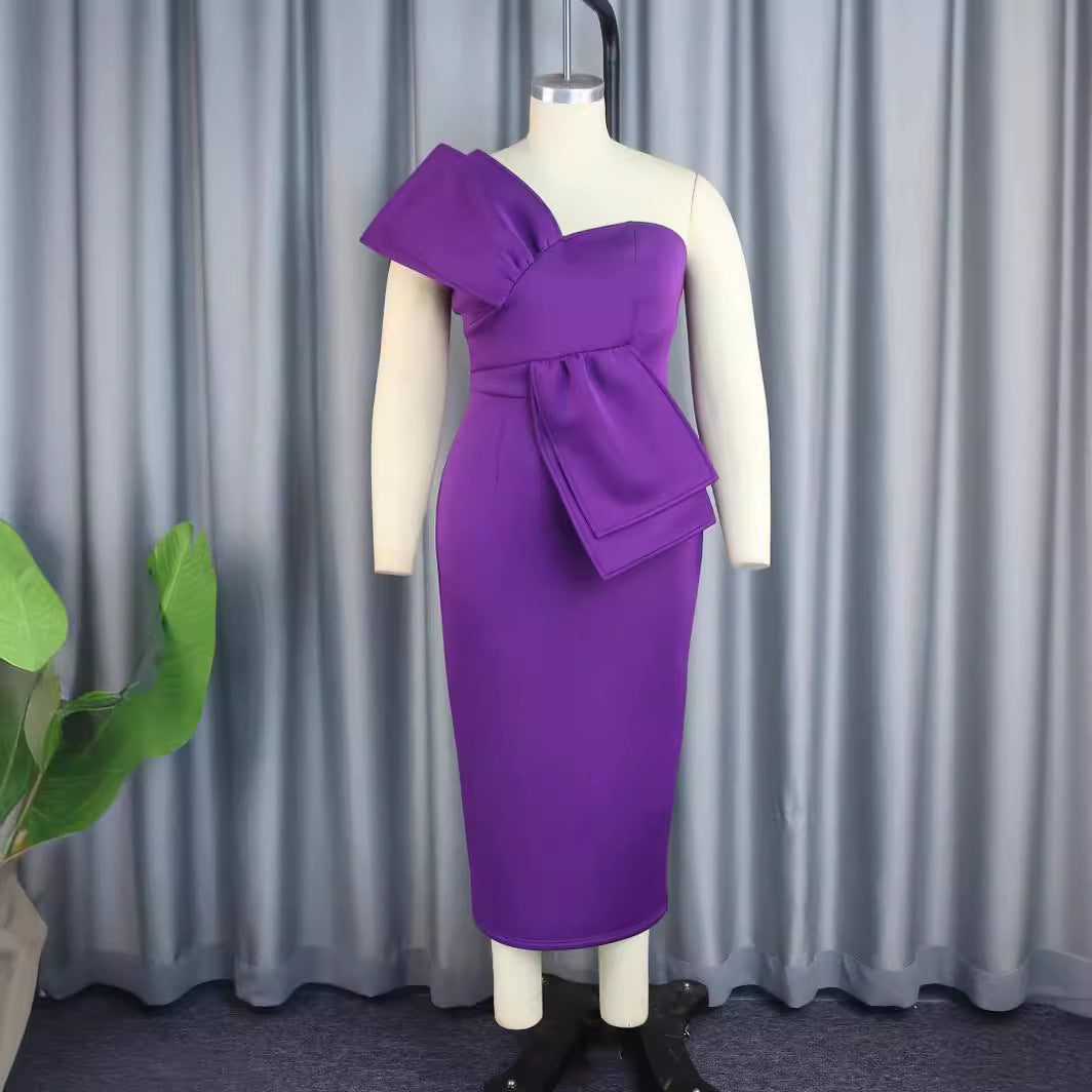Women's sheath dress with asymmetrical design and voluminous bow detail StylebySassy