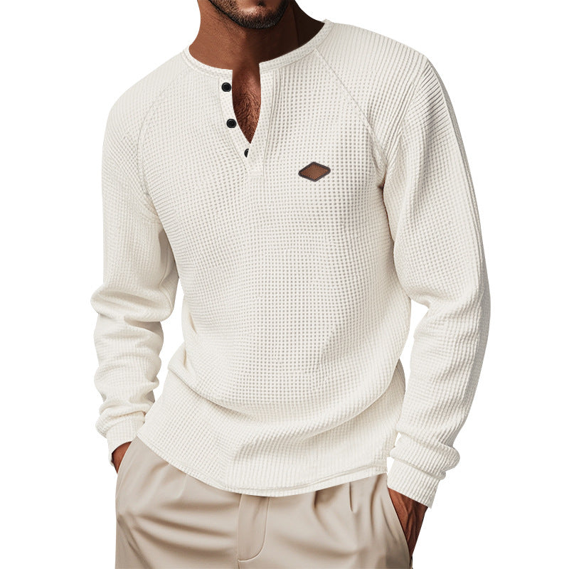 Men's structured long-sleeve shirt with short button placket, raglan sleeves, and subtle logo application StylebySassy