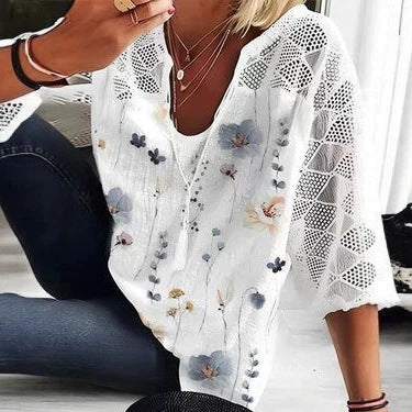 Women's V-neck tunic with lace-knit sleeves and subtle watercolor floral print StylebySassy