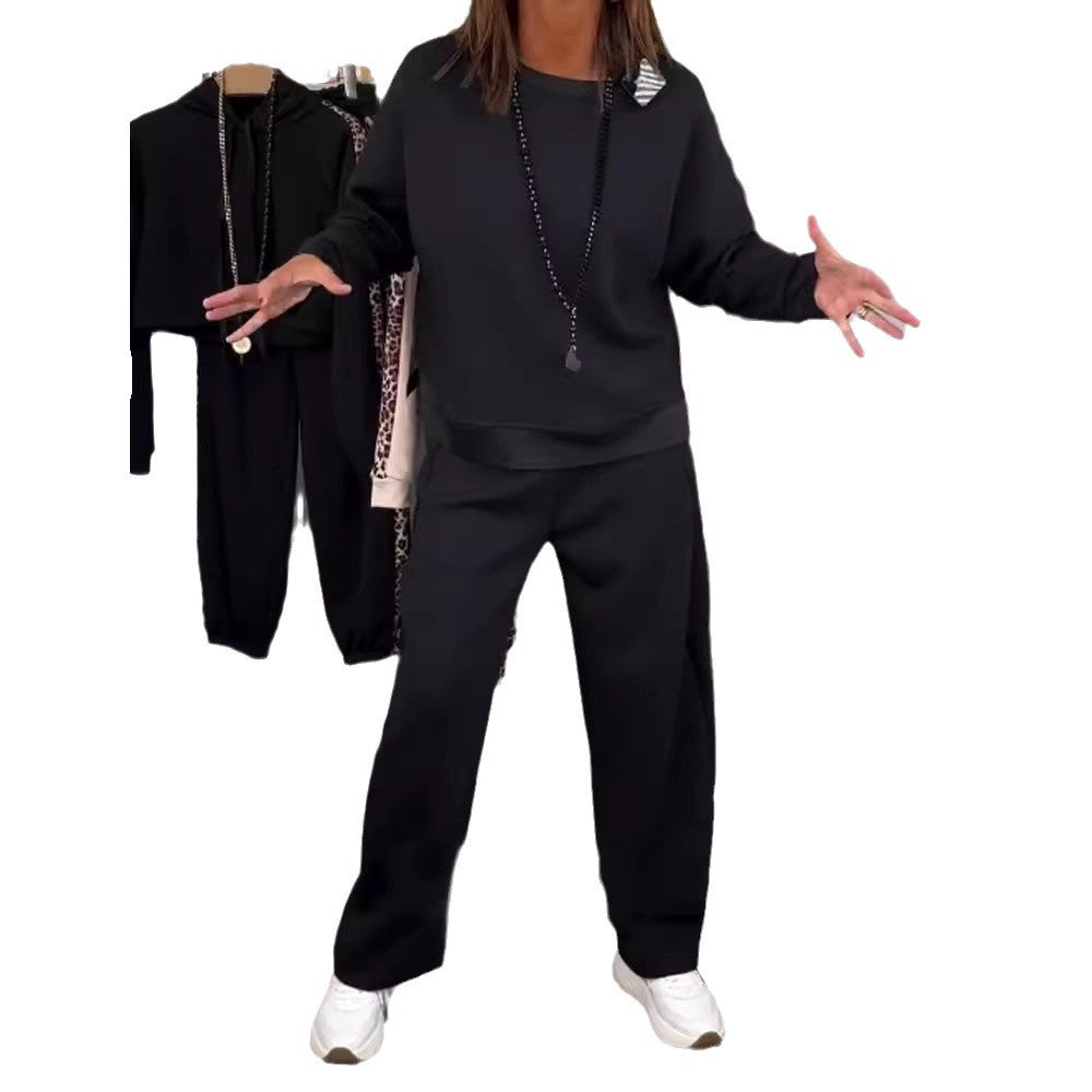 Women’s oversized jogging set with boxy sweatshirt and wide palazzo pants with decorative side stripe StylebySassy