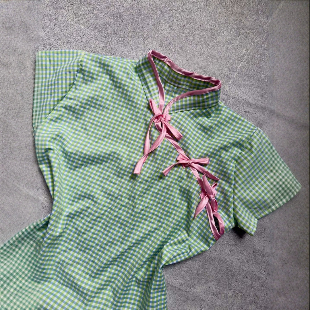 Women’s Chinese short-sleeve shirt with playful check pattern and decorative bows