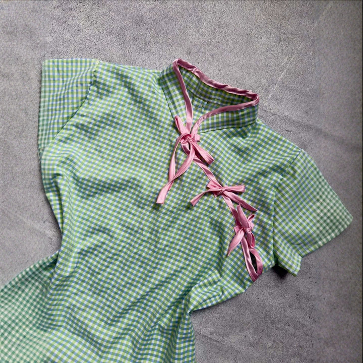 Women’s Chinese short-sleeve shirt with playful check pattern and decorative bows