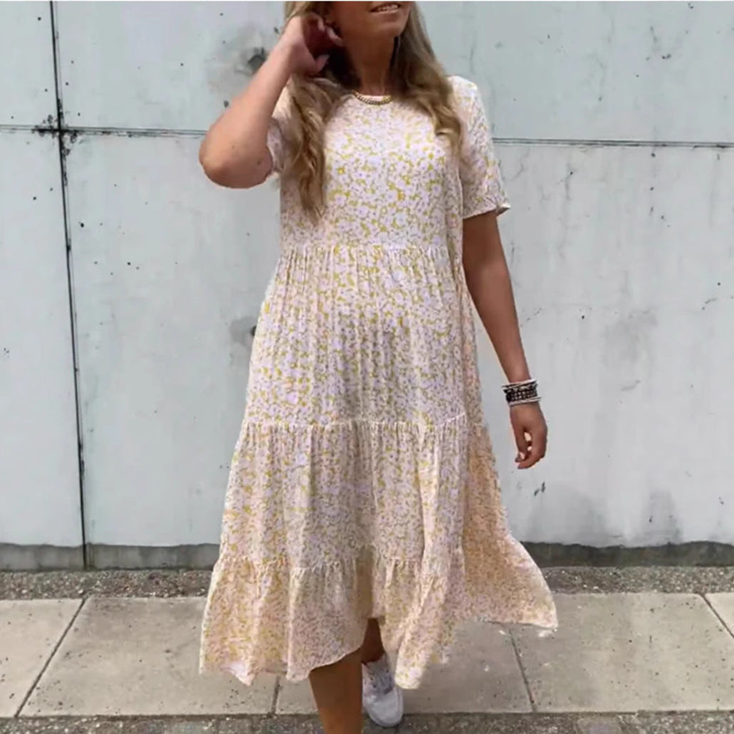 Women's flowing tiered maxi dress in Boho babydoll style with gathered underbust and short sleeves StylebySassy
