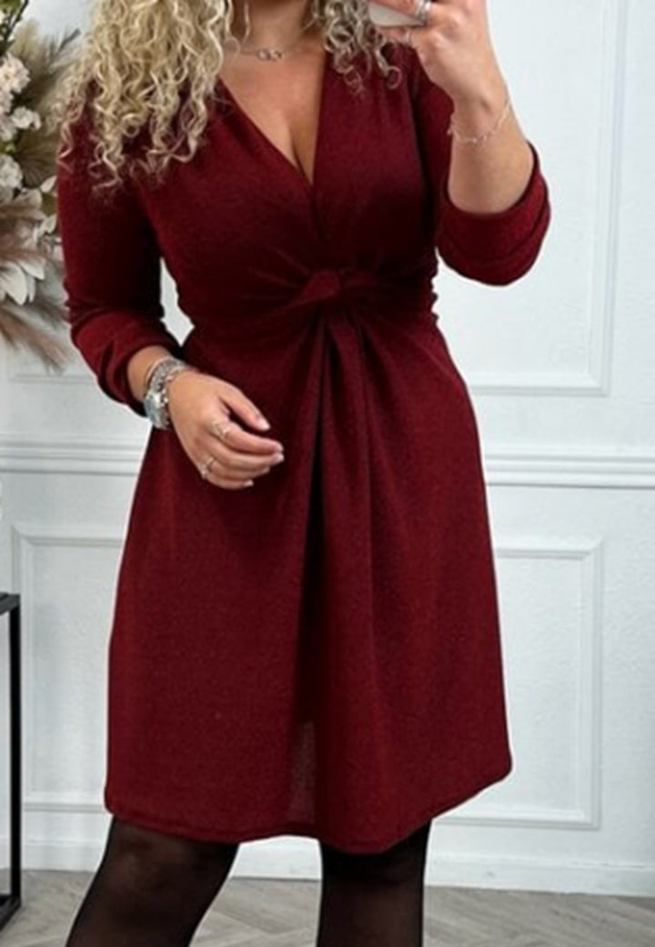Women's knee-length V-neck dress with gathered waistband made of lightweight glossy knit StylebySassy