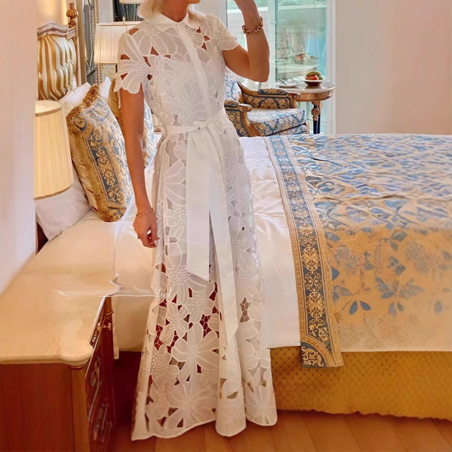 Women's flared maxi dress made of floral embroidery with a shirt collar, button placket, and tie belt StylebySassy