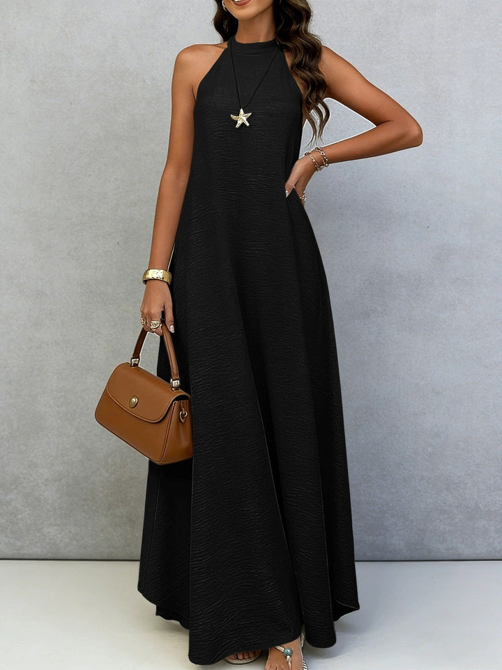 Women’s sleeveless maxi dress with high standing collar, flowing A-line and crepe texture StylebySassy