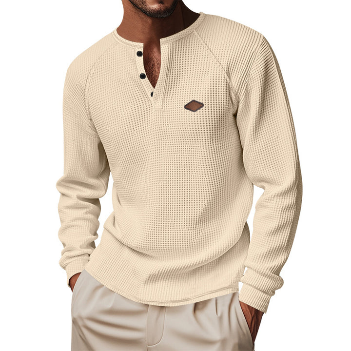 Men's structured long-sleeve shirt with short button placket, raglan sleeves, and subtle logo application StylebySassy