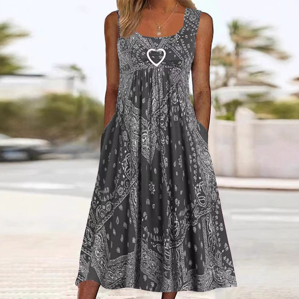 Women's airy maxi dress with paisley bandana print, gathered empire waist and practical side pockets StylebySassy