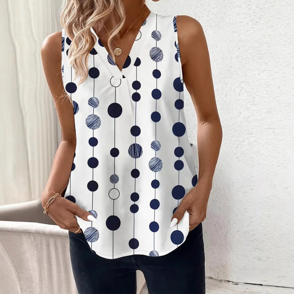 Women's V-neck blouse top with vertical polka dot pattern and subtle center seam StylebySassy