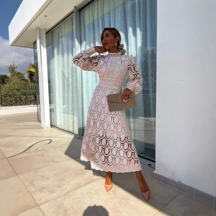 Women's crocheted midi dress with stand-up collar, transparent lace sleeves, and fitted A-line StylebySassy