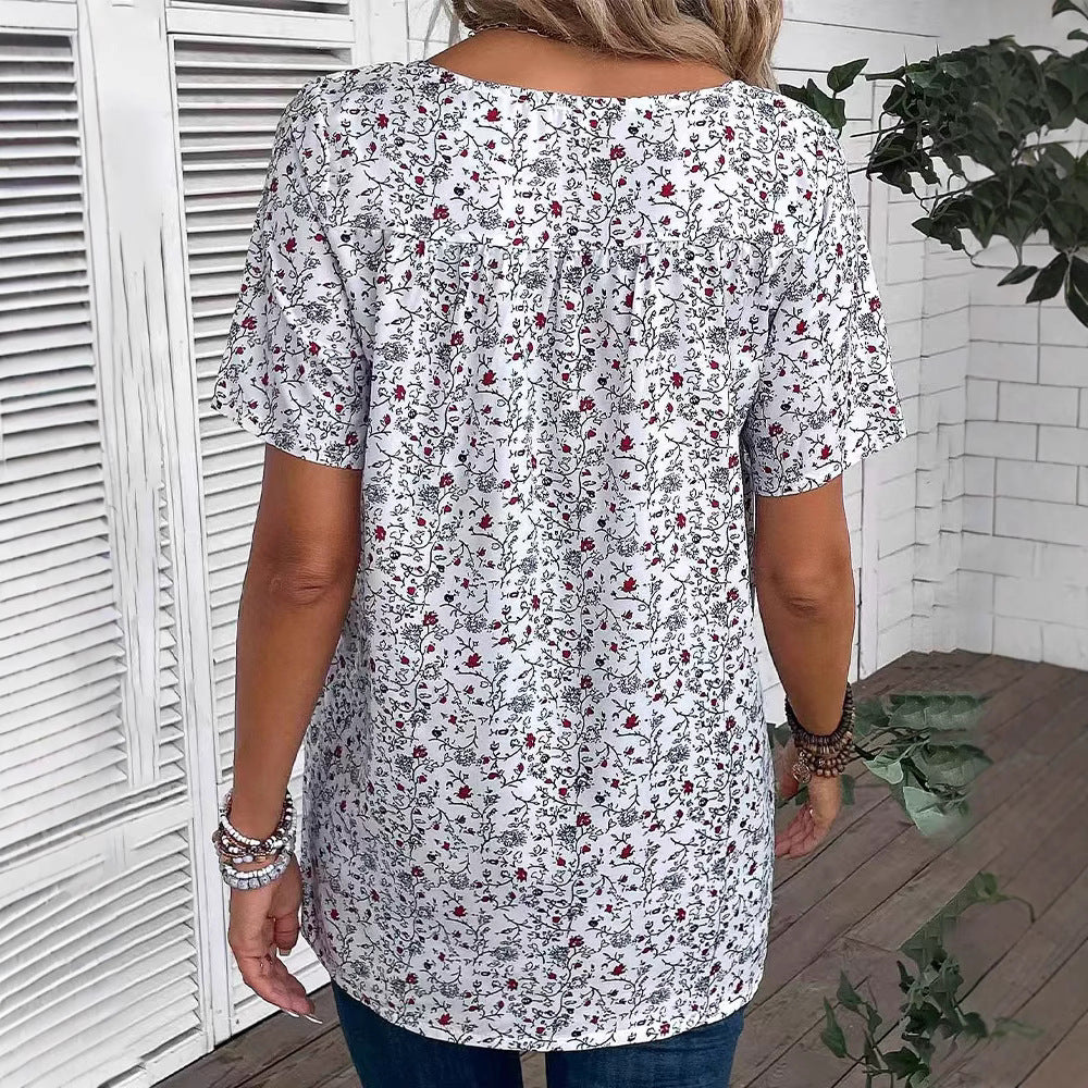 Ladies casual short-sleeve tunic shirt with round neckline, delicate all-over floral print and decorative chest pleats StylebySassy