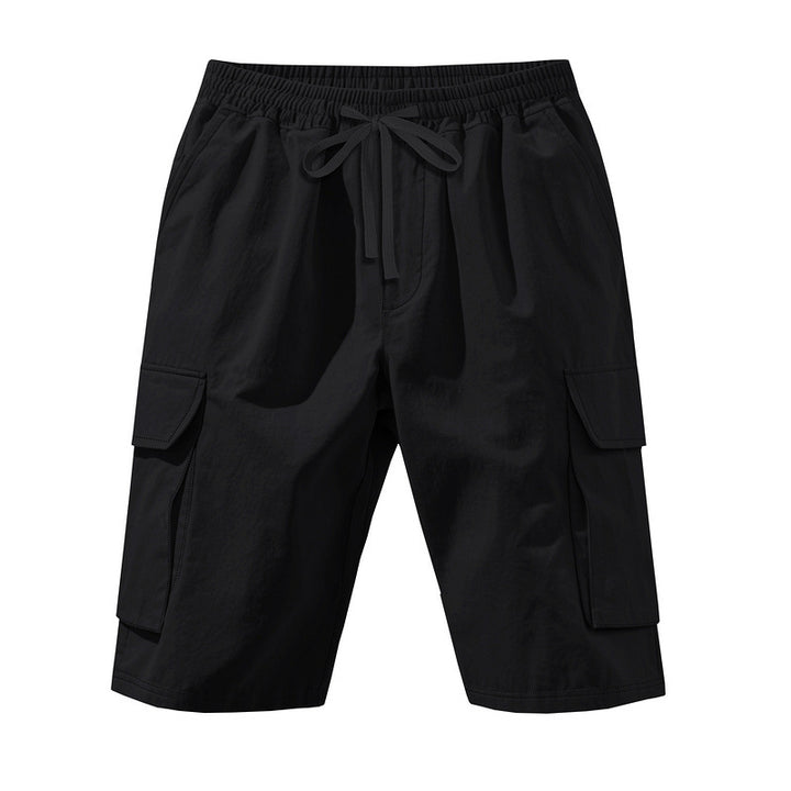 Men's knee-length utility shorts made of lightweight cotton blend with elastic drawstring waistband and patch flap pockets StylebySassy