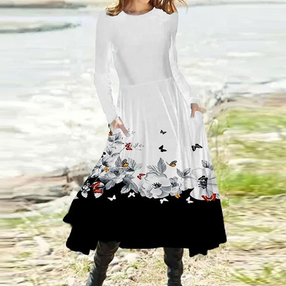 Women's flowing maxi dress with tie-dye circle pattern, round neckline, waist seam, and side pockets StylebySassy