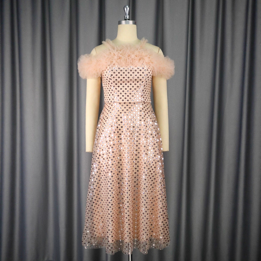 Women’s festive evening dress with voluminous ruffle details and delicate glitter StylebySassy