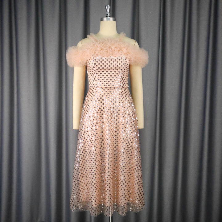 Women’s festive evening dress with voluminous ruffle details and delicate glitter StylebySassy
