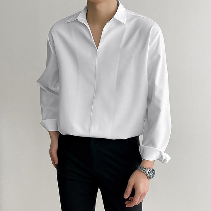Women's loosely cut tunic blouse with deep V-neck, concealed button placket, and dropped shoulders StylebySassy