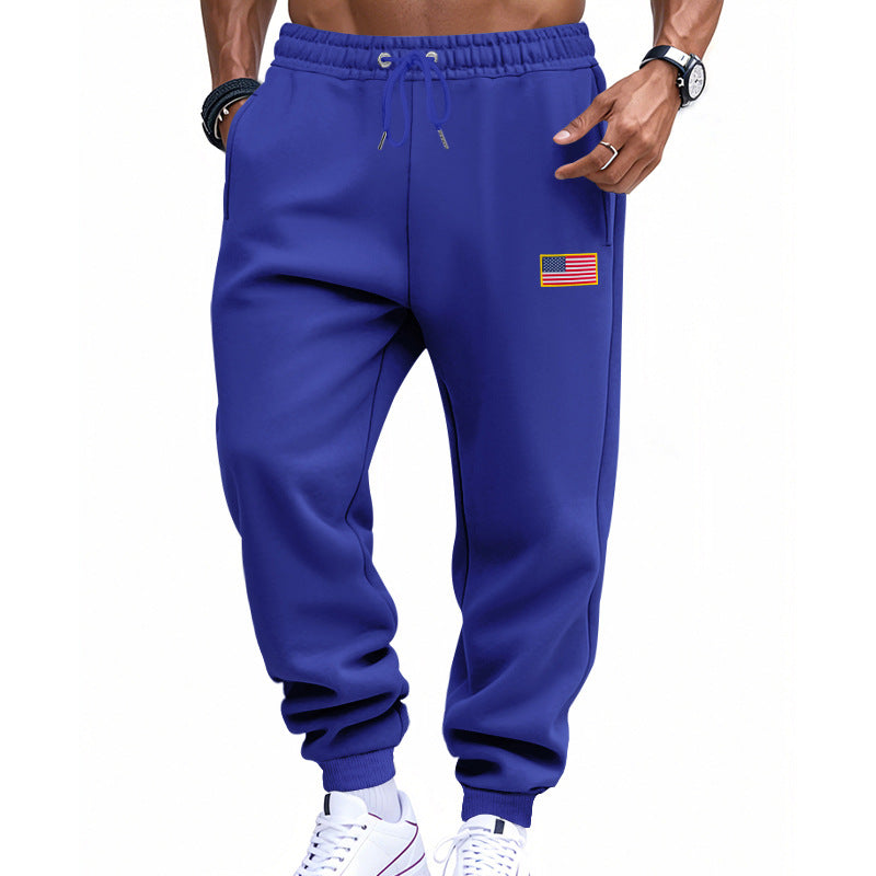 Men's slim-fit sweatpants with tapered leg, elastic drawstring waistband, and discreet flag application StylebySassy