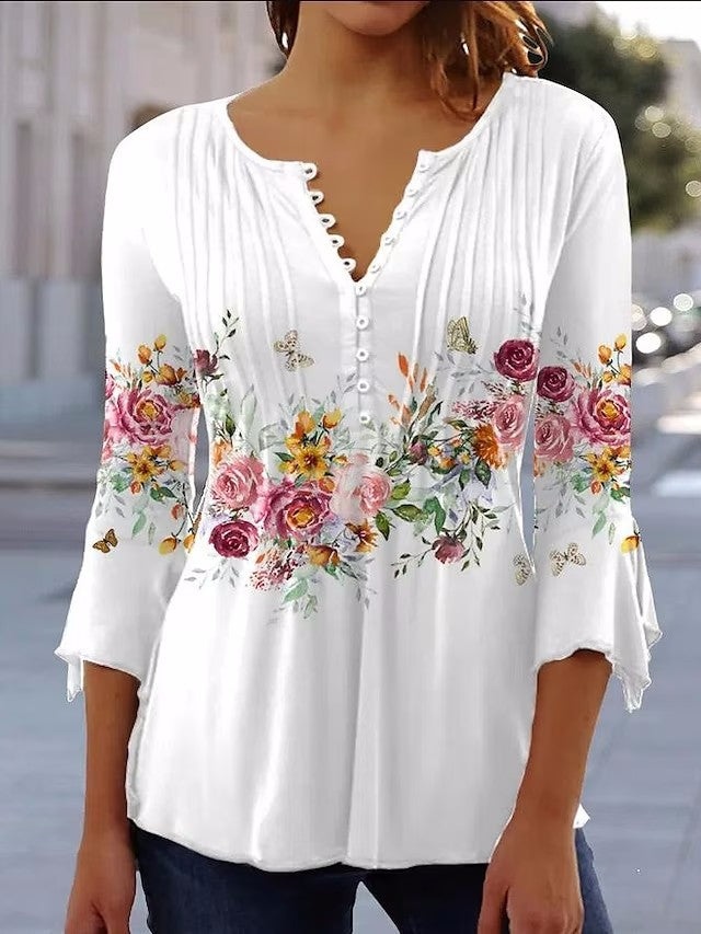 Ladies airy tunic blouse with watercolor floral border, knife pleats, and three-quarter sleeves StylebySassy