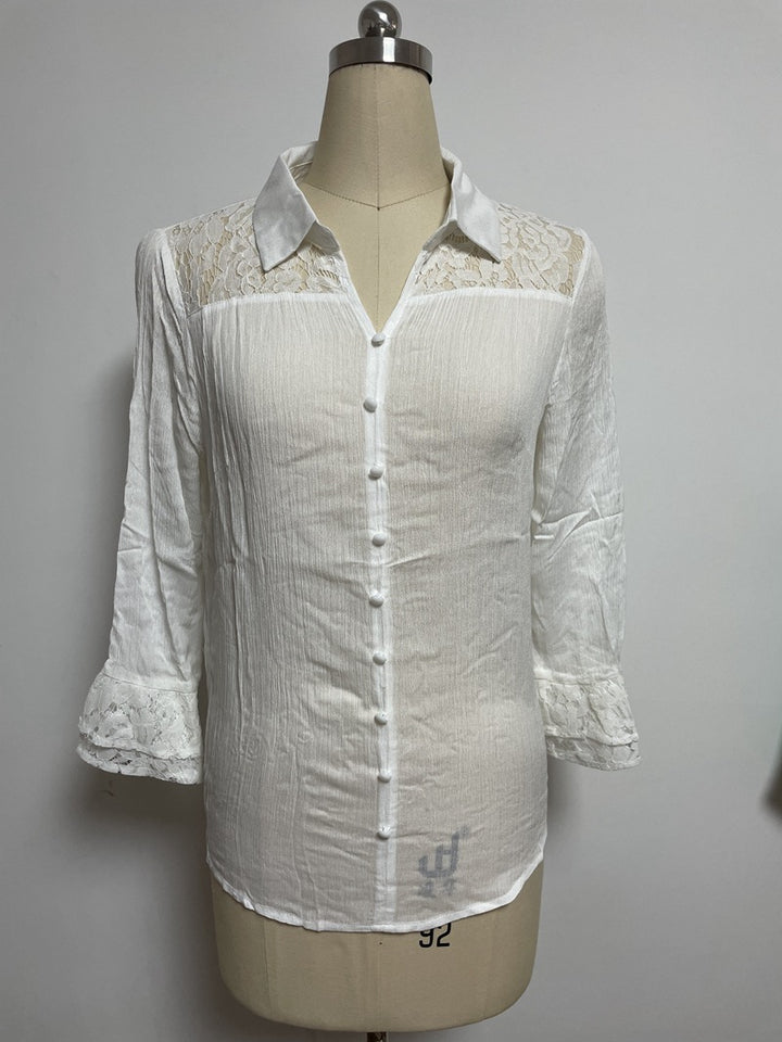 Ladies' semi-transparent crepe blouse with lace yoke, fabric-covered buttons, and three-quarter flounce sleeves StylebySassy