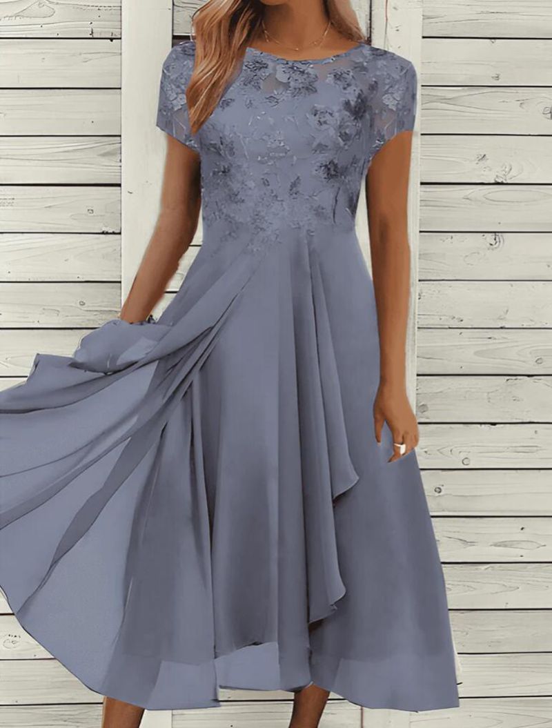 Women's flowing chiffon mid dress with floral embroidered top and asymmetrical tiered skirt StylebySassy