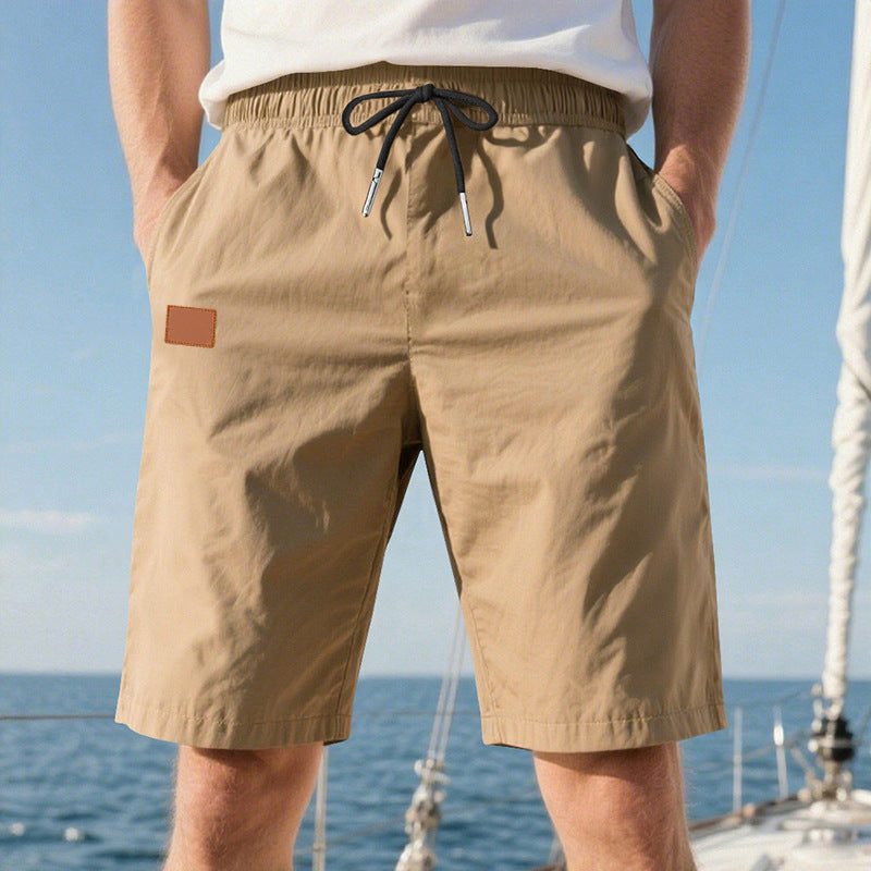 Men's quick-drying swim shorts in Bermuda cut with elastic waistband and drawstring StylebySassy