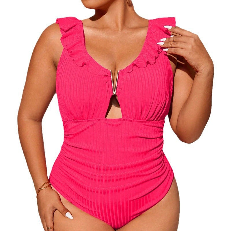 Women's one-piece swimsuit with decorative ruffle details and modern cut-out design