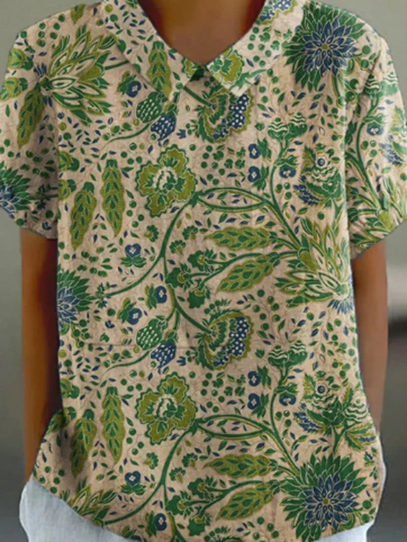 Women's casual short-sleeve blouse with V-neck, rounded hem, and botanical all-over print StylebySassy