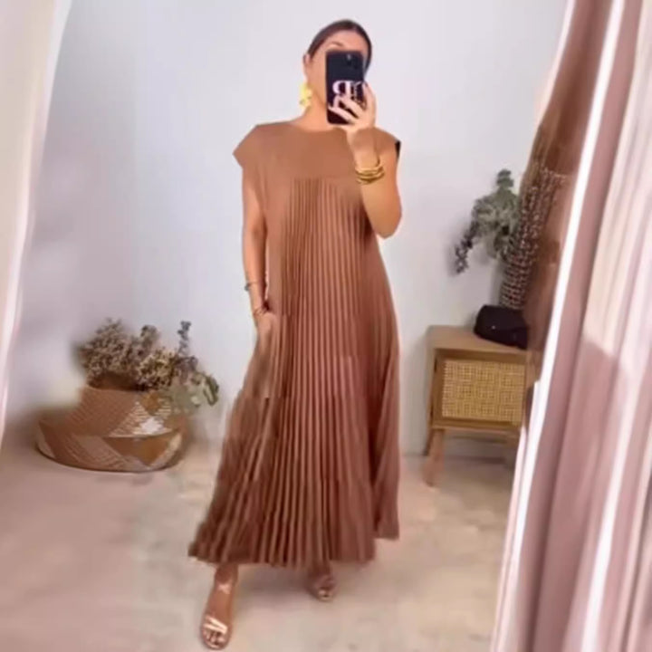 Women's flowing pleated maxi dress with dropped shoulders and side pockets StylebySassy