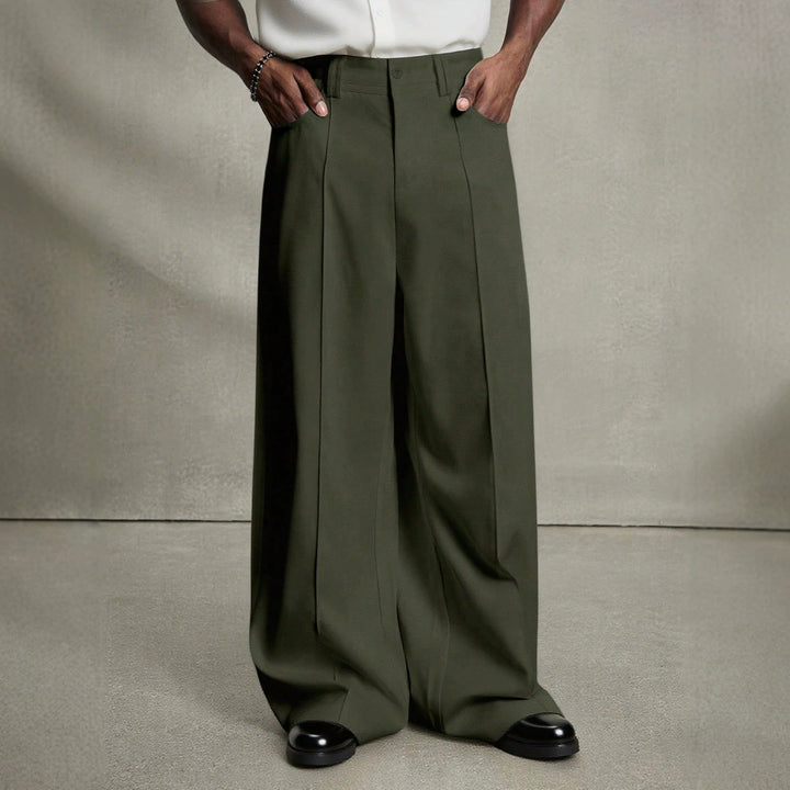 Men's wide pleated pants with high waistband, precise creases, and side inset pockets StylebySassy