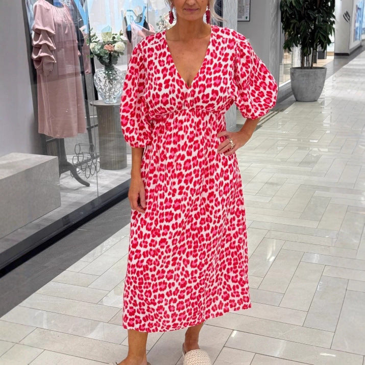 Women's maxi dress with deep V-neck, voluminous puff sleeves, and smocked waist seam StylebySassy